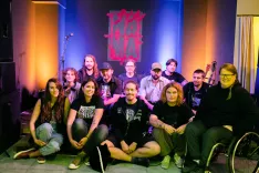 Samonikla moč skupnosti v srcu Loke: del marljivih aktivistov AKC Nama, zbranih ob prvi obletnici svojega delovanja. / Foto: Matic Zorman